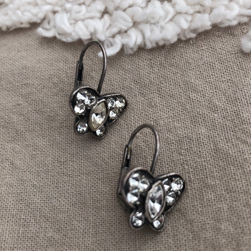 Silver butterfly earrings.